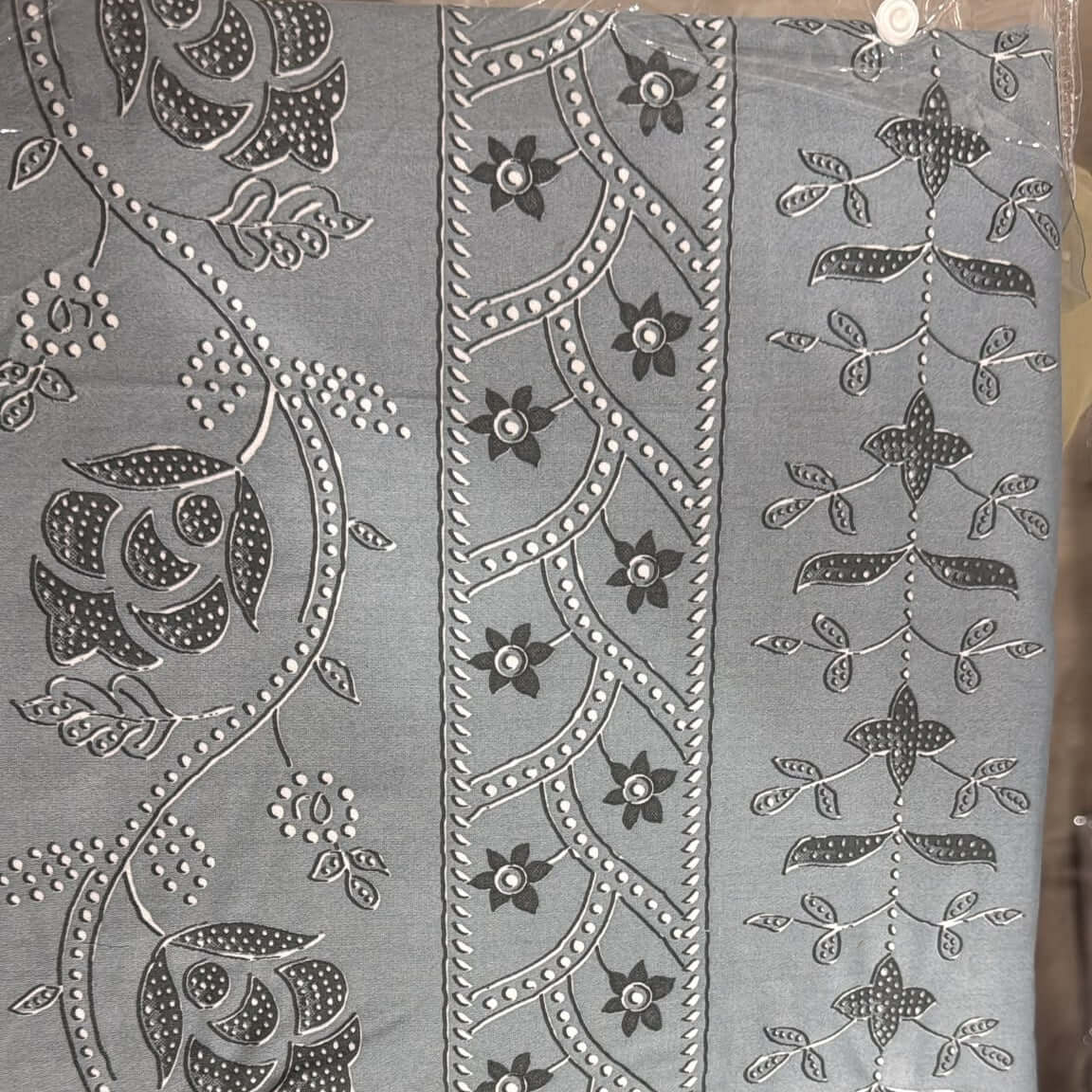 cotton floral bedsheet set featuring intricate grey floral and vine patterns on soft fabric.