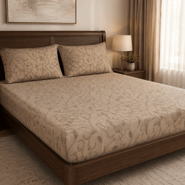 Aarniva 100% cotton floral bedsheet set in warm sand color on a wooden bed.