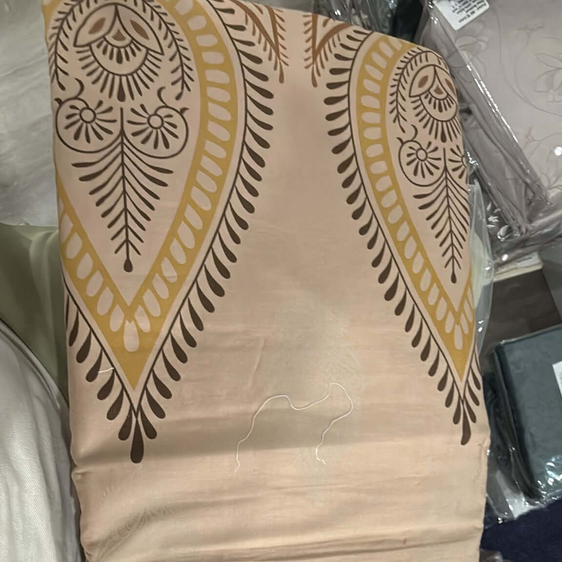 king size cotton paisley bedsheet set featuring a sand gold paisley design on soft fabric.