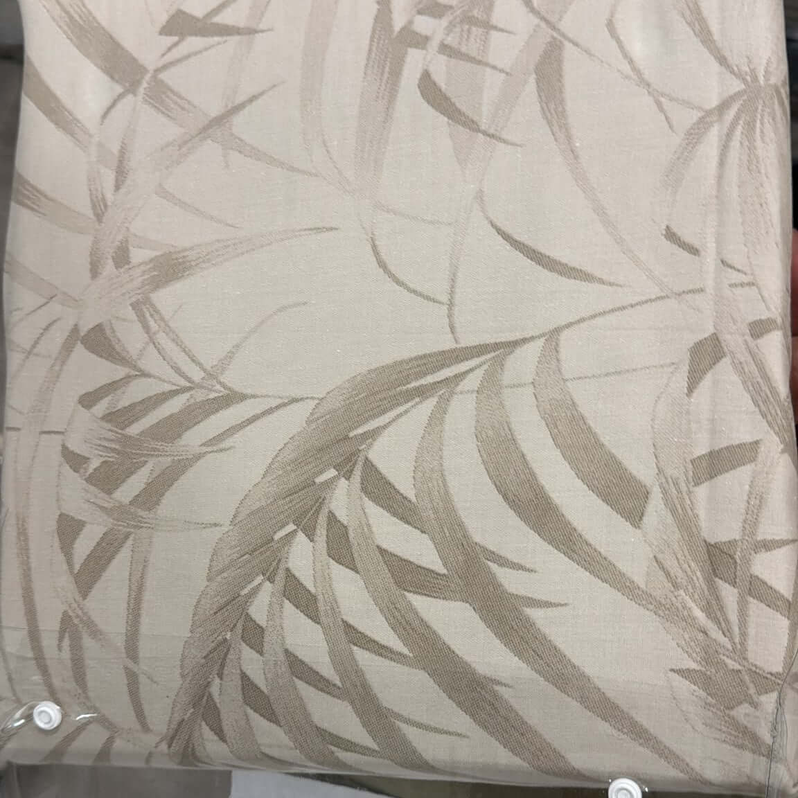 100 cotton botanical bedsheet set featuring an elegant ivory palm leaf design on soft fabric.