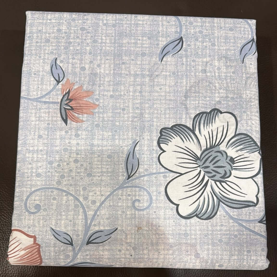 Aarniva cotton floral bedsheet set in powder blue with floral patterns on a soft backdrop.