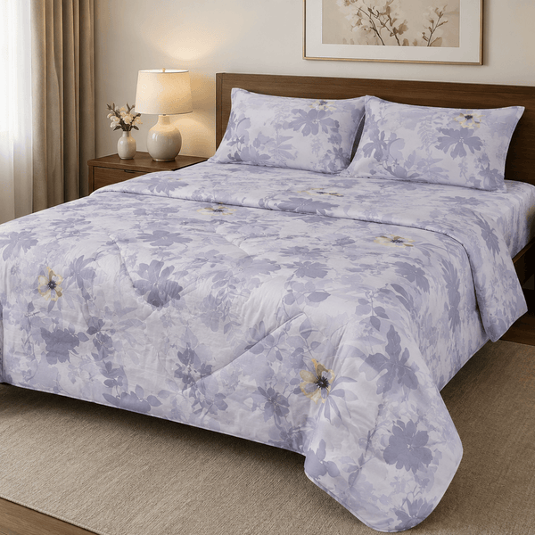 Aarniva lavender meadow comforter set displayed on a bed with floral design, creating a cozy bedroom ambiance.