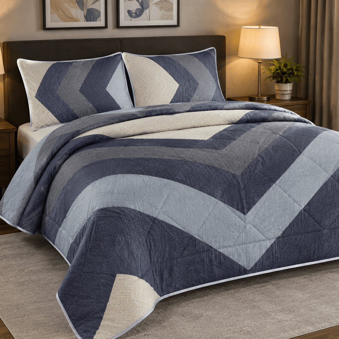 Aarniva Breathable Polyester Midnight Chevron Comforter Set on a bed, featuring a modern design with blue and cream colors.