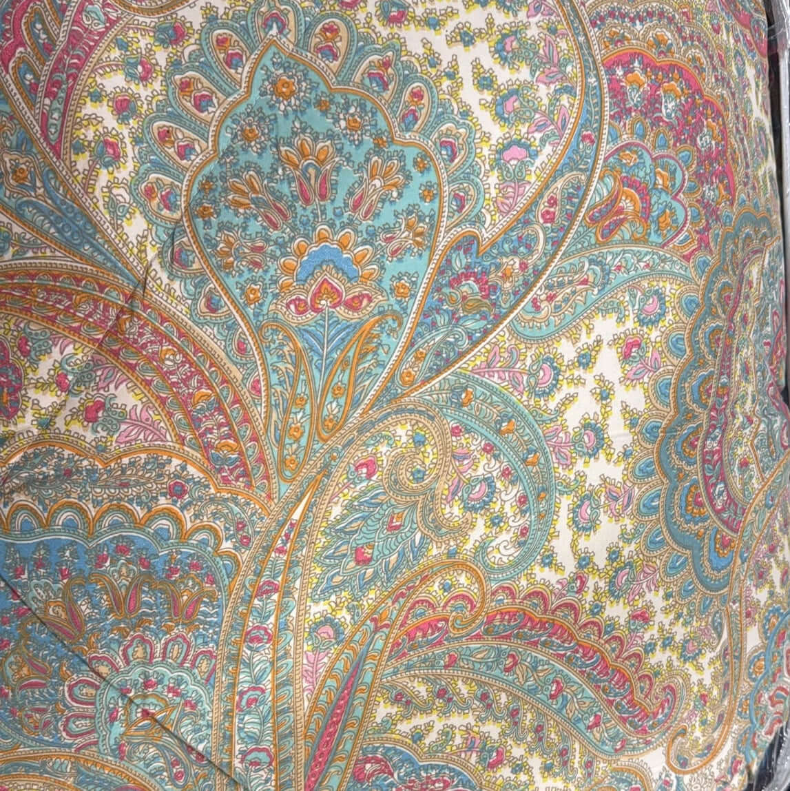 Pastel paisley comforter set featuring intricate floral patterns in vibrant colors on soft fabric.