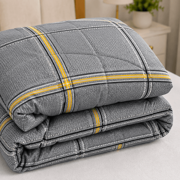 Aarniva breathable polyester comforter set in deep grey with plaid design, showcasing cozy and stylish folded comforters.