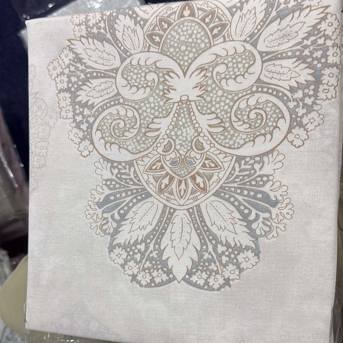 Ornamental cotton bedsheet set featuring an elegant ivory and pastel medallion design, perfect for bedding decor.