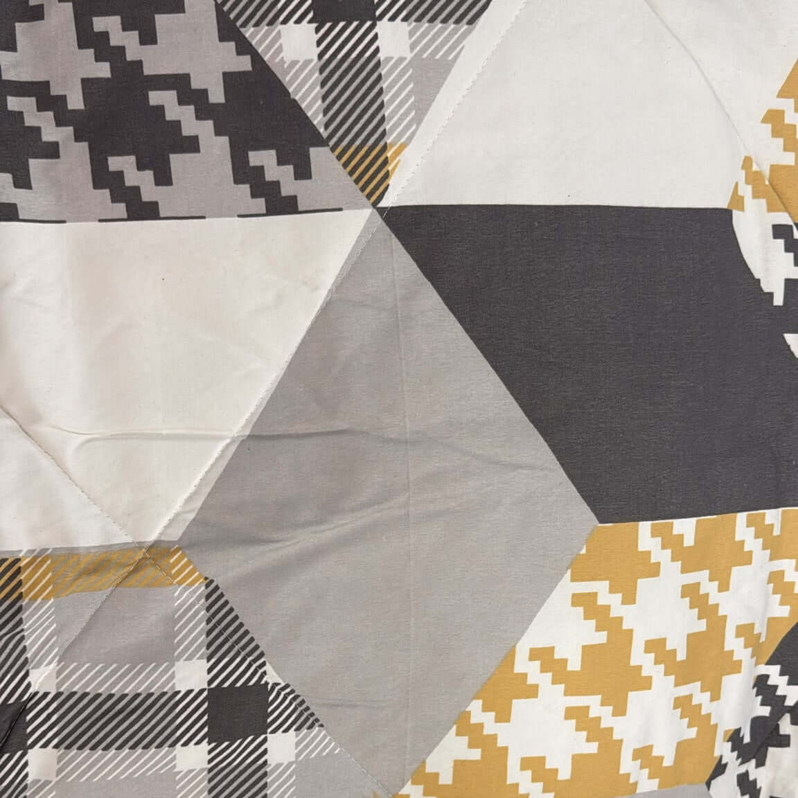 modern geo contrast comforter set featuring bold geometric patterns in black, grey, and mustard colors.