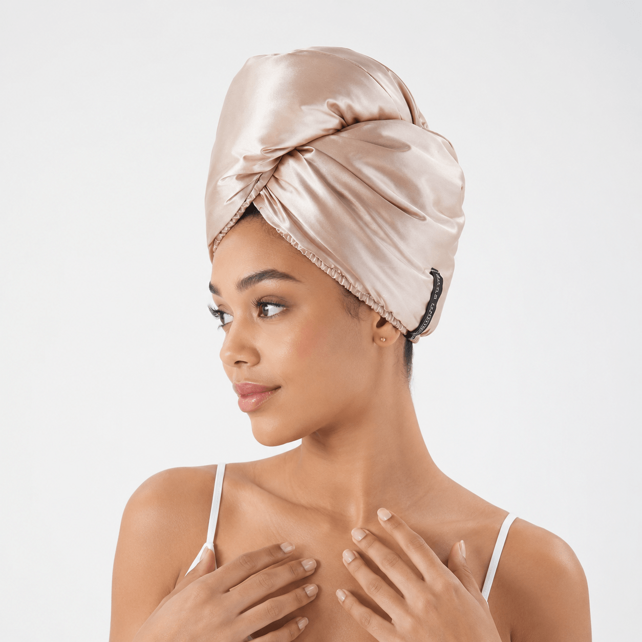 Aarniva Satin & Microfiber Hair-Drying Turban | Soft & Quick-Drying in light khaki on a model, showcasing its stylish design.