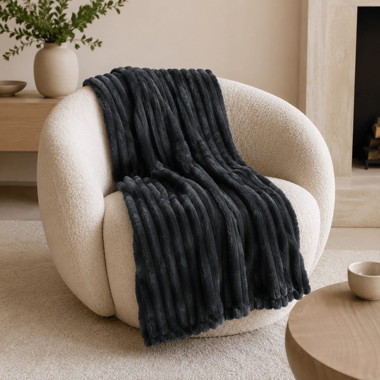 Aarniva soft flannel throw blanket with ribbed texture in dark charcoal on a cozy chair, perfect for modern home decor.