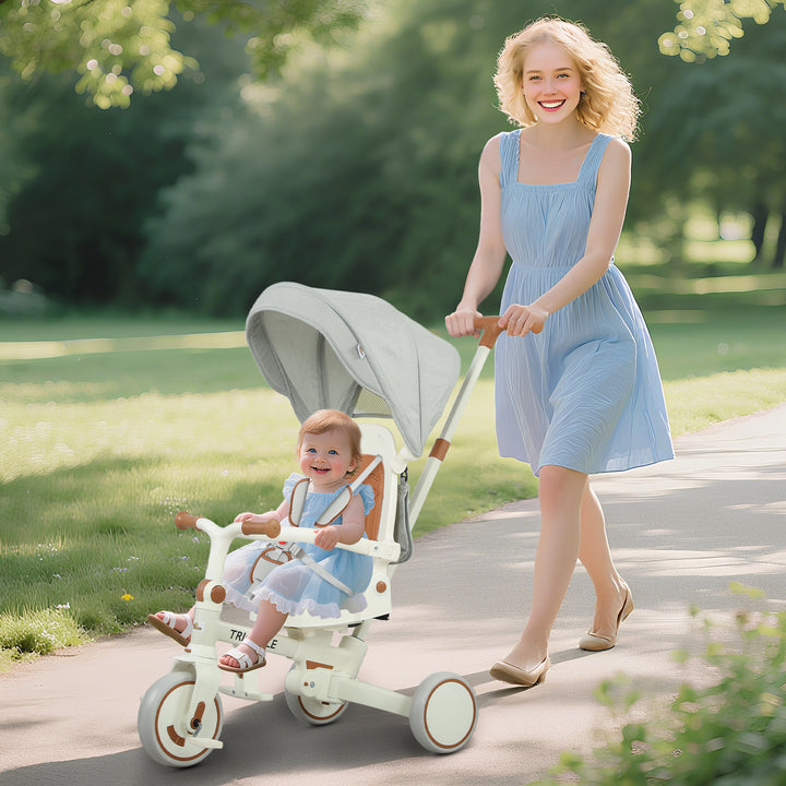 Qaba 7 in 1 Toddler Tricycle with Safety Harness, Adjustable & Removable Parent Handle, Canopy, Storage Bag, Brake, Pink