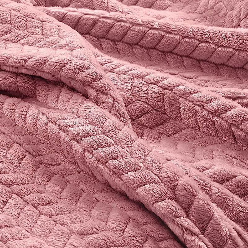 Luxurious 2-in-1 travel blanket and pillow set in plush pink quilted design, perfect for travel comfort.