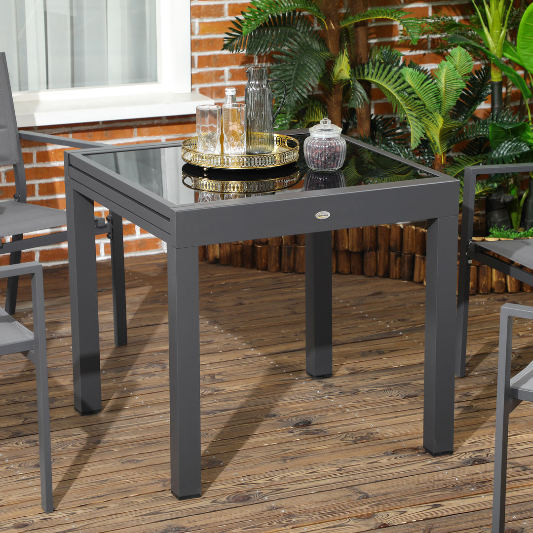 Outsunny 63" Extendable Outdoor Dining Table Patio Table with Aluminum Frame and Tempered Glass Tabletop, Black