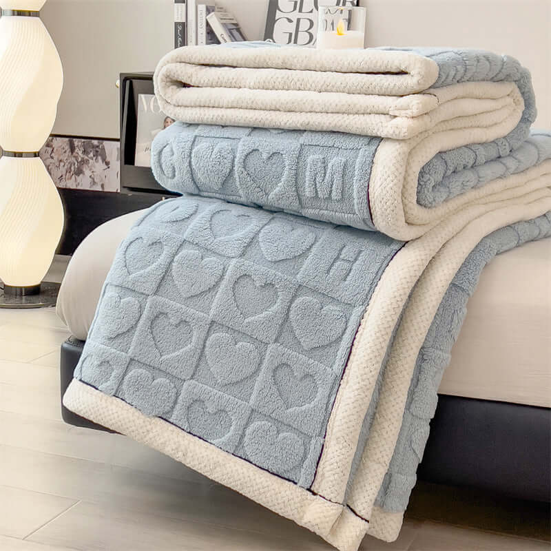 New Love Taffu multifunctional coral fleece blanket in blue showcasing heart patterns, perfect for cozy home settings.