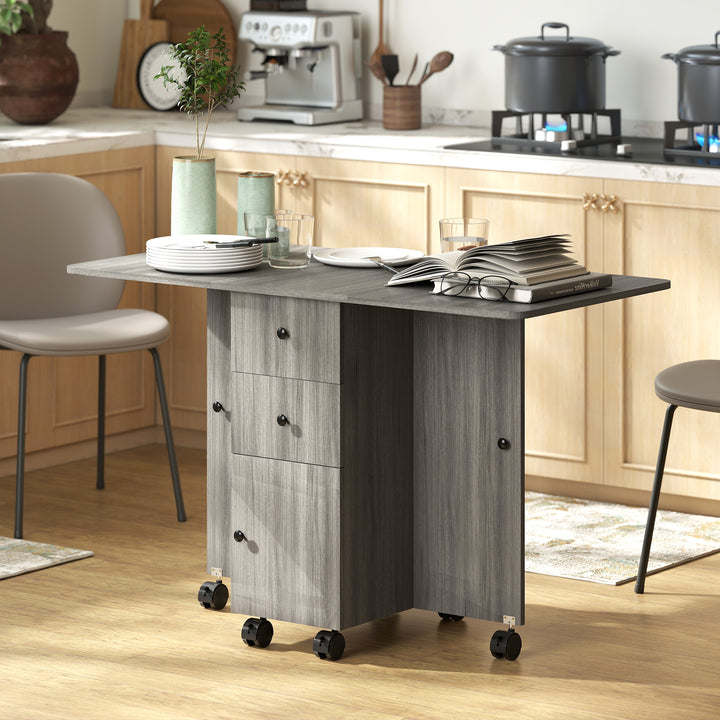 HOMCOM Foldable Dining Table, Rolling Kitchen Table with Storage Drawers and Cabinet, Drop Leaf Table on Wheels, Grey